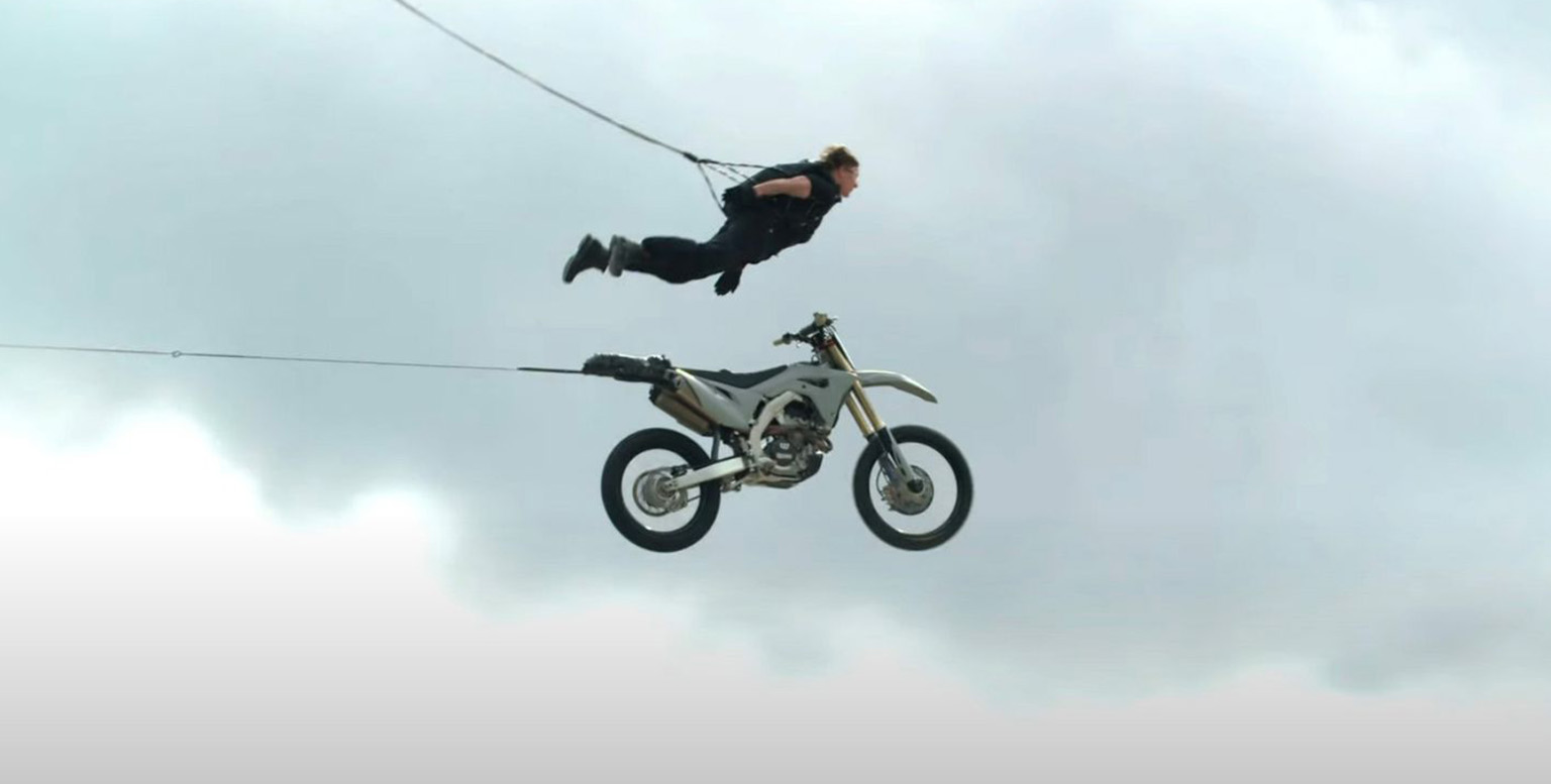 Tom Cruise performs a daring stunt in Mission: Impossible