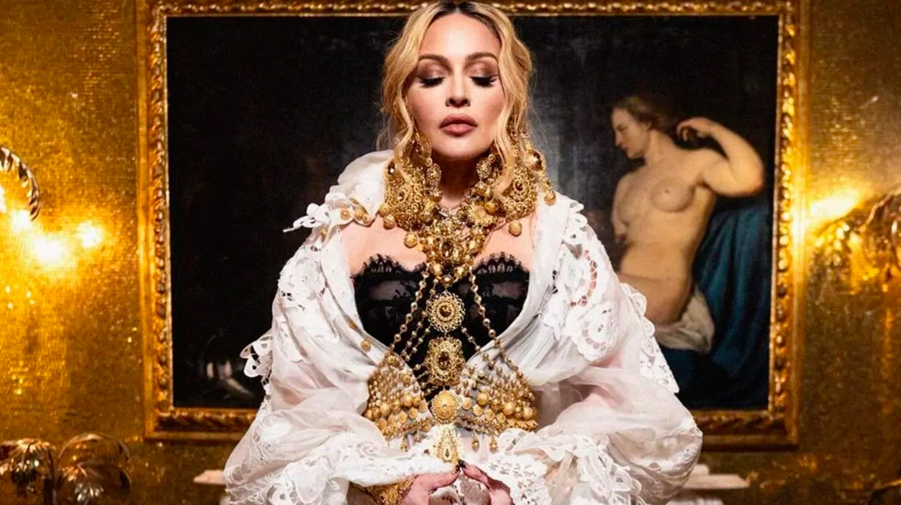 Madonna in an opulent, romantic setting, reflecting her Venus in Leo’s love for luxury, admiration, and passion.